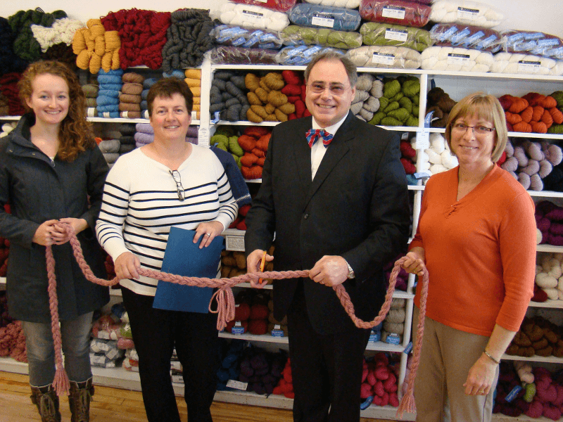 Mayor of Shelburne cuts ribbon at Wool & Silk Co. grand opening